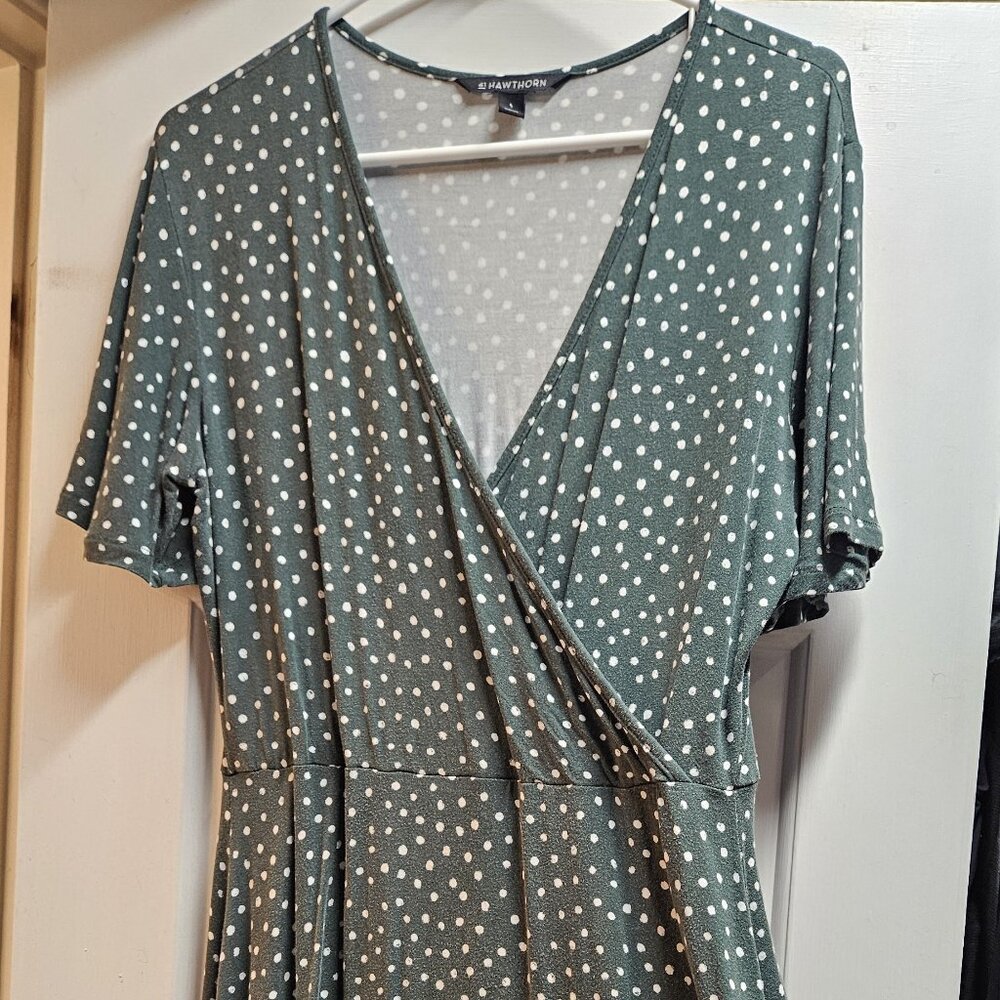 Green fit and flare dress with white polka dots